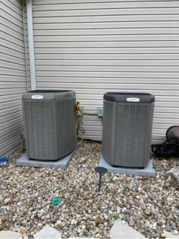 two ennox hvac unit outside